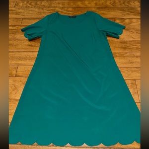 Green dress with scalloped details